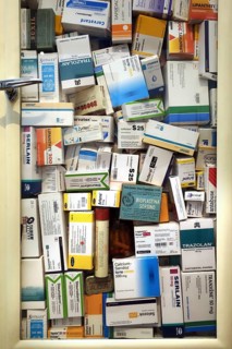 Medicine cabinet filled with medication boxes, drugs for treating mental diseases