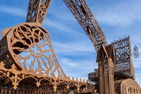 Caterpillar + Flatbed Trailer, artwork by Belgian neo-conceptual artist Wim Delvoye at seaside