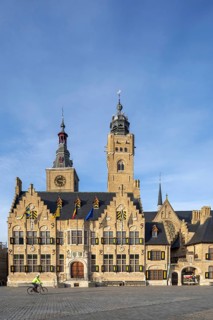 Market square showing town hall with belfy and St Nicholas Church tower, rebuilt after WWI in the
