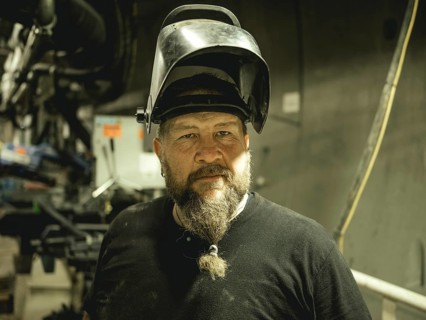 Welder in a tunnel section of the double shield tunnel boring machine in the H53 construction lot