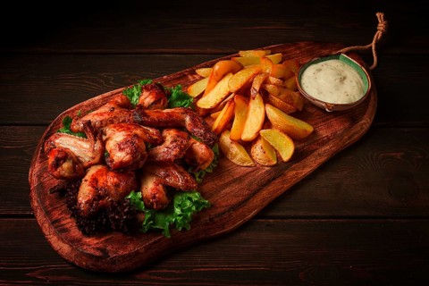 Fried chicken wings, with potatoes, and spices, homemade, fast food, no people
