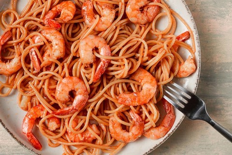Spaghetti with king shrimps, with spices, top view, selective focus, homemade, no people