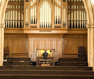 Man playing organ, St Andrews Hall, Norwich, Norfolk, England, UK