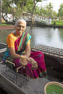 Tealady, 83 years old, shows an Indian tea on her boat, Backwaters, Kumarakom, Kerala, India, Asia