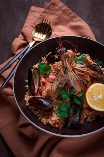 Seafood paella, shrimp and mussels risotto, rice, homemade, top view, no people