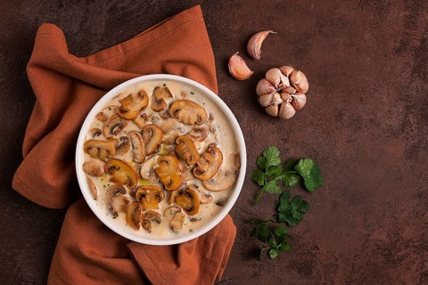 Champignons in creamy garlic sauce, with herbs and spices, gravy, sauce, no people
