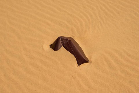 Sheet metal fragment on a sandy surface in the desert, Matruh, Great Sand Sea, Libyan Desert,