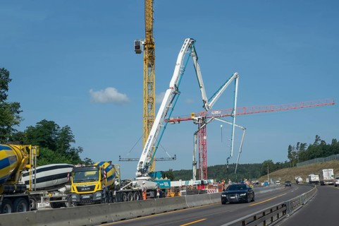 Construction cranes at a building site on the A6 motorway, Bavaria, Germany, Europe