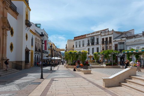 Picturesque Spanish street with historic buildings and relaxed atmosphere, Plaza del Socorro, Old