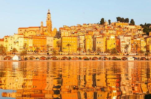 The town of Menton reflected in the sea, Menton, Côte d'Azur, Provence, France, Europe