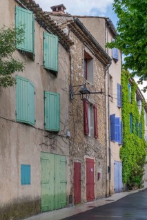 House facades with colourful window and door shutters, Vauvenargues, place of work of Pablo Picasso