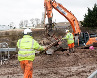Engineering work on flood defences on the King's Sedgemoor Drain river at Dunball, near Bridgwater,