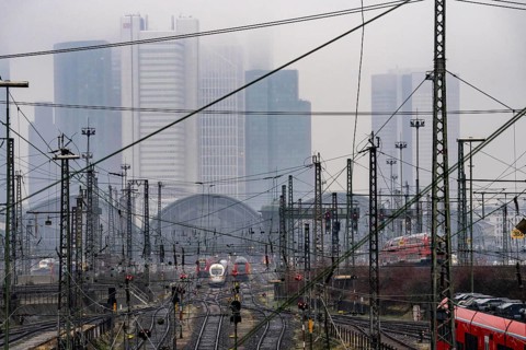Railway tracks with regional and long-distance trains, ICE, after freezing rain, in front of