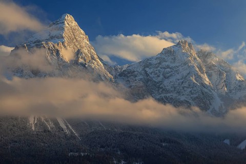 Steep mountain peaks above clouds in the evening light, winter, snow, Sonnenspitze and Mieminger