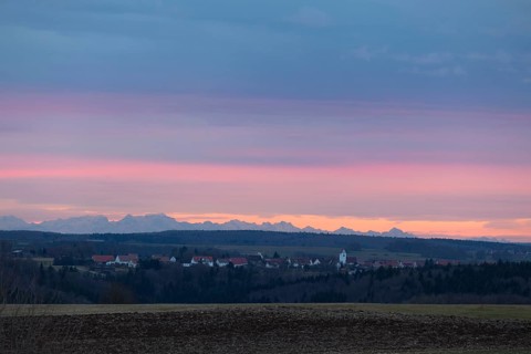 Alpine panorama near Magolsheim. Säntis, Swiss Alps at sunset with a view of Mehrstetten. View from