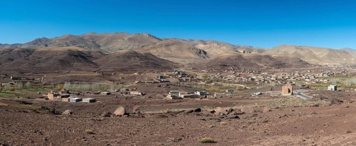 View of Taboulmante with colourful mountains in the background, layered landscape, Gorges du Dades,
