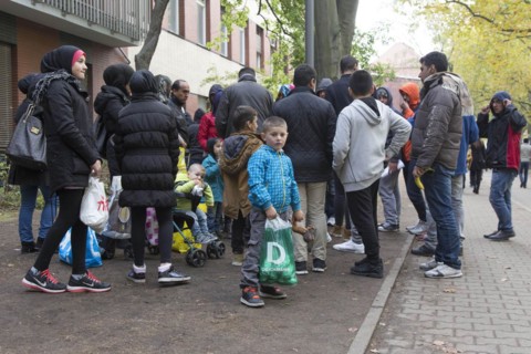 Refugees from Syria waiting to be registered at the Central Reception Centre for Asylum Seekers at