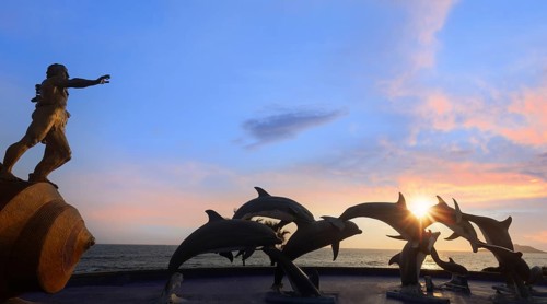 Mexico, Dolphin silhouettes at Mazatlan sea promenade, El Malecon near tourist beaches and scenic