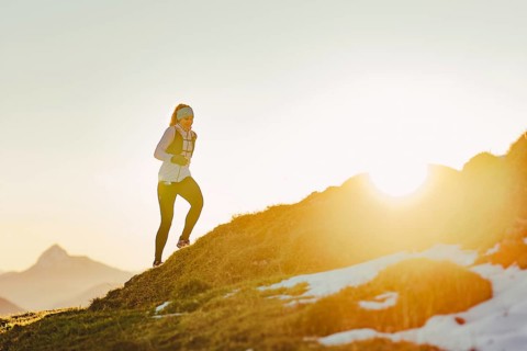 Trail running in autumn on the Jochberg on Lake Walchensee against the wonderful backdrop of the