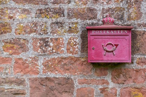 Mailbox on a red sandstone wall, Rhineland-Palatinate, Germany, Europe