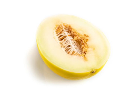 Sliced ripe yellow melon isolated on white background. Side view, close up. harvest, women health,