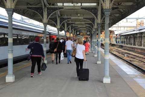 Rail passengers on platform of railway train station, Norwich, Norfolk, England, UK