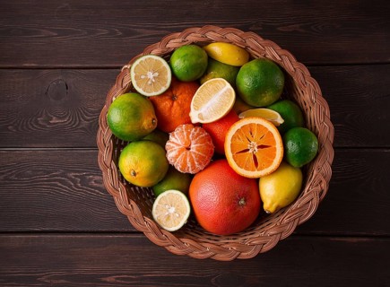 Assortment, citrus fruits, in a basket, close-up, top view, no people