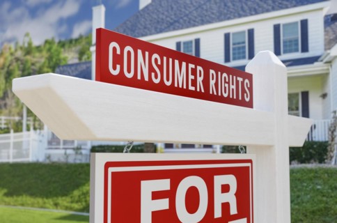 Consumer rights for sale real estate sign in front of new house