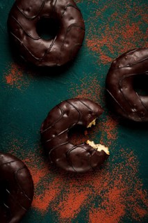 Donuts with cocoa, in chocolate glaze, top view, no people