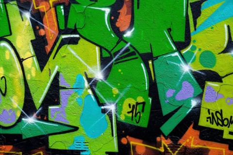 Vivid green graffiti with yellow accents on a wall, Landau, Rhineland-Palatinate, Germany, Europe