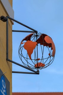 Globe as nose sign of a travel agency, Sulzbach-Rosenberg, Upper Palatinate, Bavaria, Germany,