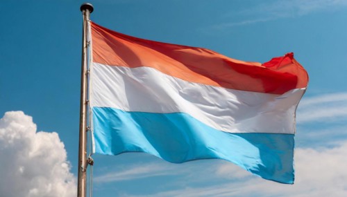 Flags, the national flag of Luxembourg flutters in the wind