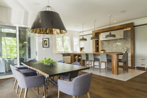 Chrome and walnut wood table with charcoal linen armchairs, large black and gold industrial style