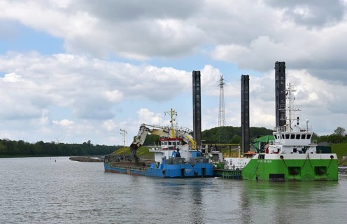 Working with a dredger on the Kiel Canal to widen the canal, Kiel Canal, Schleswig-Holstein,