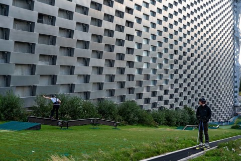 CopenHill, waste incineration plant and artificial ski slope, skiing with a view of the ski lift,