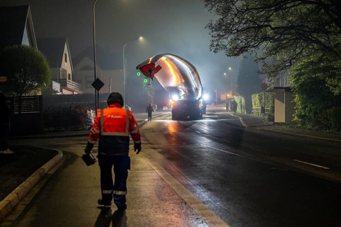 Transport of a 68 metre long, 22 tonne blade of a wind turbine, here in Breckerfeld, with a