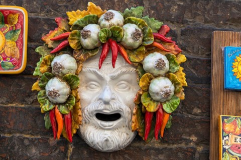 Colourful porcelain head, sculpture, representation, prosperity, food, nutrition, symbol, souvenir,