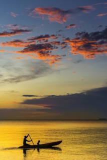 Canoe in sunset, sunset, horizon, evening light, boat, sun, evening mood, cloudy sky, colourful,