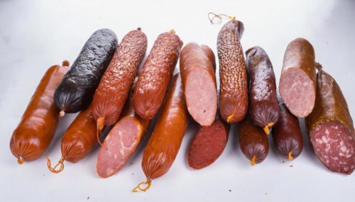 Food, meat products, various smoked sausages on a white surface AI generated, AI generated