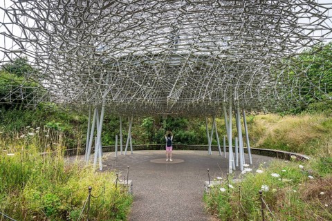 Visitor stands under The Hive, artwork by Wolfgang Buttress, Royal Botanic Gardens (Kew Gardens),