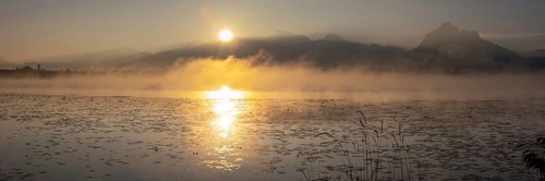 Sunrise at Lake Hopfensee near Füssen, behind Hopfen am See, the Tegelberg massif and the Säuling,