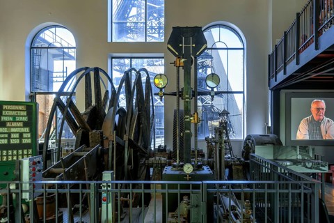 Winding engine with depth indicator to raise and lower lift cage in mine shaft at Le Bois du Cazier