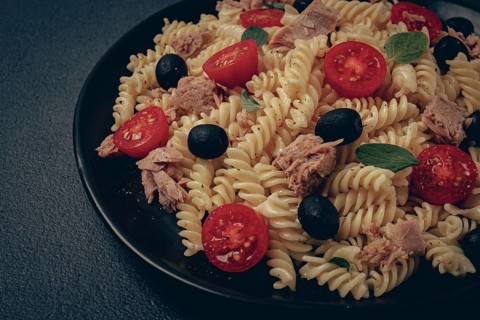 Tuna salad, fusilli pasta, olives and cherry, olive oil, homemade
