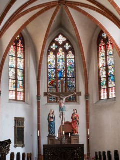 Altar with crucifixion group under the cross vault of St Michael's parish church, Bernkastel,