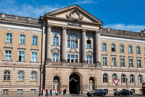 Magnificent entrance to a building with imposing façade and columns, former post office building,
