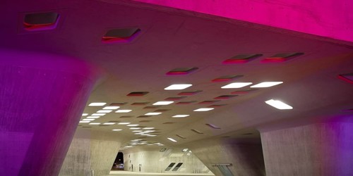 The colourfully illuminated phæno building, an experimental landscape and a science centre in the