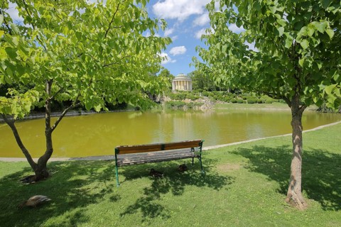 Lake with park bench and Leopoldine Temple in the palace park Spring, Esterházy, Esterhazy,