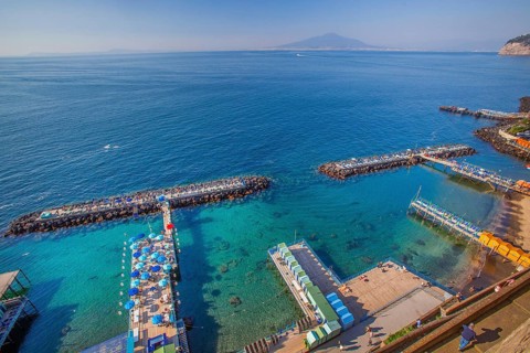 Bathing jetties below the cliffs, Sorrento, Sorrento Peninsula, Gulf of Naples, Campania, Italy,
