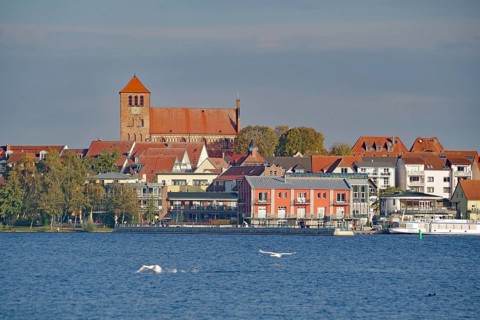 Town view with church and red roofs directly on the water, Tourism, Waren Mecklenburg-Vorpommern,
