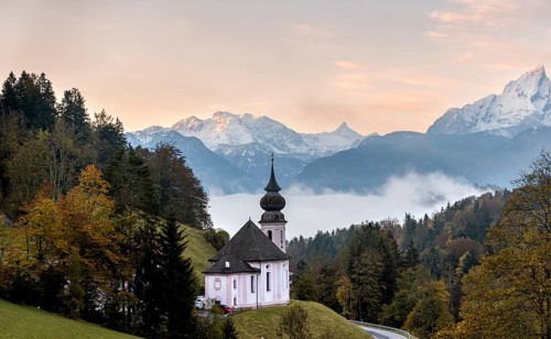 Maria Gern pilgrimage church at sunrise, behind Schönfeldspitze and the Watzmann, in autumn,
